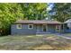 Gray brick house with a small front yard at 516 Fairlane Nw Cir, Atlanta, GA 30331