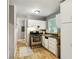Kitchen boasts white cabinets and stainless steel appliances at 516 Fairlane Nw Cir, Atlanta, GA 30331