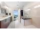 Spa-like bathroom with a large shower, soaking tub, and dual vanities at 1080 Peachtree Ne St # 3309, Atlanta, GA 30309