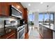Sleek kitchen featuring stainless steel appliances and dark wood cabinetry at 1080 Peachtree Ne St # 3309, Atlanta, GA 30309