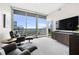 Living Room with city views and access to balcony at 1080 Peachtree Ne St # 3309, Atlanta, GA 30309