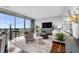 Bright living room with hardwood floors, city views, and stylish furnishings at 1080 Peachtree Ne St # 3309, Atlanta, GA 30309