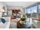 Open concept living room and kitchen with hardwood floors and city views at 1080 Peachtree Ne St # 3309, Atlanta, GA 30309