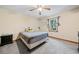 This simple bedroom is brightly lit with new carpet and a ceiling fan at 175 Highland Cir, Mcdonough, GA 30253