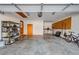 Large two-car garage with storage shelves, workspace, and convenient access door at 175 Highland Cir, Mcdonough, GA 30253