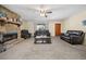 Comfortable living room with a stone fireplace and neutral carpet at 175 Highland Cir, Mcdonough, GA 30253