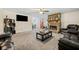 Spacious carpeted living room featuring a stone fireplace at 175 Highland Cir, Mcdonough, GA 30253