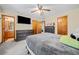 Spacious main bedroom features neutral carpet and a ceiling fan at 175 Highland Cir, Mcdonough, GA 30253