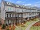 Charming townhomes featuring craftsman-style architecture and landscaped front yards at 1979 Flying Scotsman Dr # 16, Kennesaw, GA 30144
