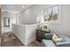 Stylish upstairs hallway featuring hardwood floors and natural light at 1979 Flying Scotsman Dr # 16, Kennesaw, GA 30144