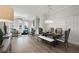 Open-concept living space with hardwood floors, stylish furnishings, and abundant natural light at 1979 Flying Scotsman Dr # 16, Kennesaw, GA 30144