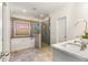 Bathroom boasts a soaking tub, walk-in shower, and double vanity at 2440 Brantley Nw St, Atlanta, GA 30318