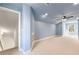 Spacious bonus room with light blue walls and carpeting at 2440 Brantley Nw St, Atlanta, GA 30318