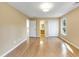 Spacious bedroom with hardwood floors and ensuite bath at 1120 Graystone Xing, Alpharetta, GA 30005