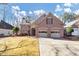 Two-story brick home with a two-car garage at 1120 Graystone Xing, Alpharetta, GA 30005