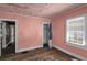 Needs renovation. Bedroom with hardwood floors and closet at 1142 Cahaba Dr, Atlanta, GA 30311