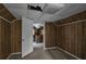 Small bedroom with wood paneling and carpeted floor at 1142 Cahaba Dr, Atlanta, GA 30311