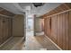 Bedroom with wood paneling and bathroom access at 1142 Cahaba Dr, Atlanta, GA 30311