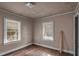 Small bedroom with hardwood floors and two windows at 1142 Cahaba Dr, Atlanta, GA 30311