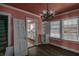 Dining room with hardwood floors, chandelier, and kitchen view at 1142 Cahaba Dr, Atlanta, GA 30311
