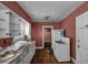 Kitchen with white cabinets, gas stove, and double sink at 1142 Cahaba Dr, Atlanta, GA 30311