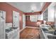 Kitchen with white cabinets, gas stove, and double sink at 1142 Cahaba Dr, Atlanta, GA 30311