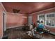 Needs renovation. Living room with hardwood floors and a fireplace at 1142 Cahaba Dr, Atlanta, GA 30311