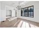 Sunlit dining room with hardwood floors and chandelier at 190 Carl Sanders Dr, Acworth, GA 30101