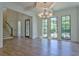 Formal dining room with hardwood floors, chandelier, and large windows at 190 Carl Sanders Dr, Acworth, GA 30101