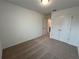 Well-lit bedroom featuring neutral walls, carpet flooring, and a double-door closet at 2116 Stillhaven Pl, Douglasville, GA 30135