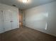 Well-lit bedroom with double-door closet and access to hallway at 2116 Stillhaven Pl, Douglasville, GA 30135