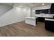 Modern kitchen with white quartz countertops, stainless steel appliances, and dark cabinetry at 2116 Stillhaven Pl, Douglasville, GA 30135