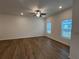 Spacious living room with hardwood floors and ceiling fan at 2116 Stillhaven Pl, Douglasville, GA 30135