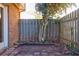 Small fenced backyard with a patio and mature tree at 3312 Northcrest Rd # A, Atlanta, GA 30340