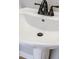 Close-up of a pedestal sink with oil-rubbed bronze faucet at 3312 Northcrest Rd # A, Atlanta, GA 30340