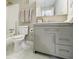 Bathroom with gray vanity, bathtub, and white toilet at 3312 Northcrest Rd # A, Atlanta, GA 30340