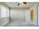 Spacious bedroom with ceiling fan, carpet, and window at 3312 Northcrest Rd # A, Atlanta, GA 30340