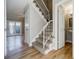 Light-filled entryway with staircase, wood floors, and access to other rooms at 3312 Northcrest Rd # A, Atlanta, GA 30340