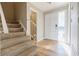 Light and bright entryway with stairs and half bath at 3312 Northcrest Rd # A, Atlanta, GA 30340