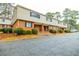 Brick building exterior with multiple units and parking at 3312 Northcrest Rd # A, Atlanta, GA 30340