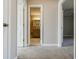 Hallway with carpet and doors to bedrooms and a bathroom at 3312 Northcrest Rd # A, Atlanta, GA 30340