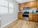 Updated kitchen with stainless steel appliances and wood cabinets at 3312 Northcrest Rd # A, Atlanta, GA 30340