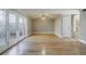 Hardwood floor living room with patio access and ceiling fan at 3312 Northcrest Rd # A, Atlanta, GA 30340