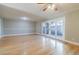 Spacious living room with hardwood floors and doors to patio at 3312 Northcrest Rd # A, Atlanta, GA 30340