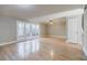 Living room with hardwood floors, ceiling fan and patio doors at 3312 Northcrest Rd # A, Atlanta, GA 30340