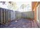 Small patio area with a gate leading to a grassy yard at 3312 Northcrest Rd # A, Atlanta, GA 30340