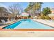 Community swimming pool with lounge chairs and no diving sign at 3312 Northcrest Rd # A, Atlanta, GA 30340