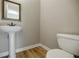 Small half bathroom with pedestal sink and toilet at 3312 Northcrest Rd # A, Atlanta, GA 30340