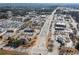 Aerial view of a business district with roadways, shops, businesses, and parking at 333 Gardens Of Harmony Dr, Canton, GA 30115