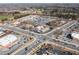 Aerial view of a commercial district, showing well-maintained storefronts and ample parking at 333 Gardens Of Harmony Dr, Canton, GA 30115